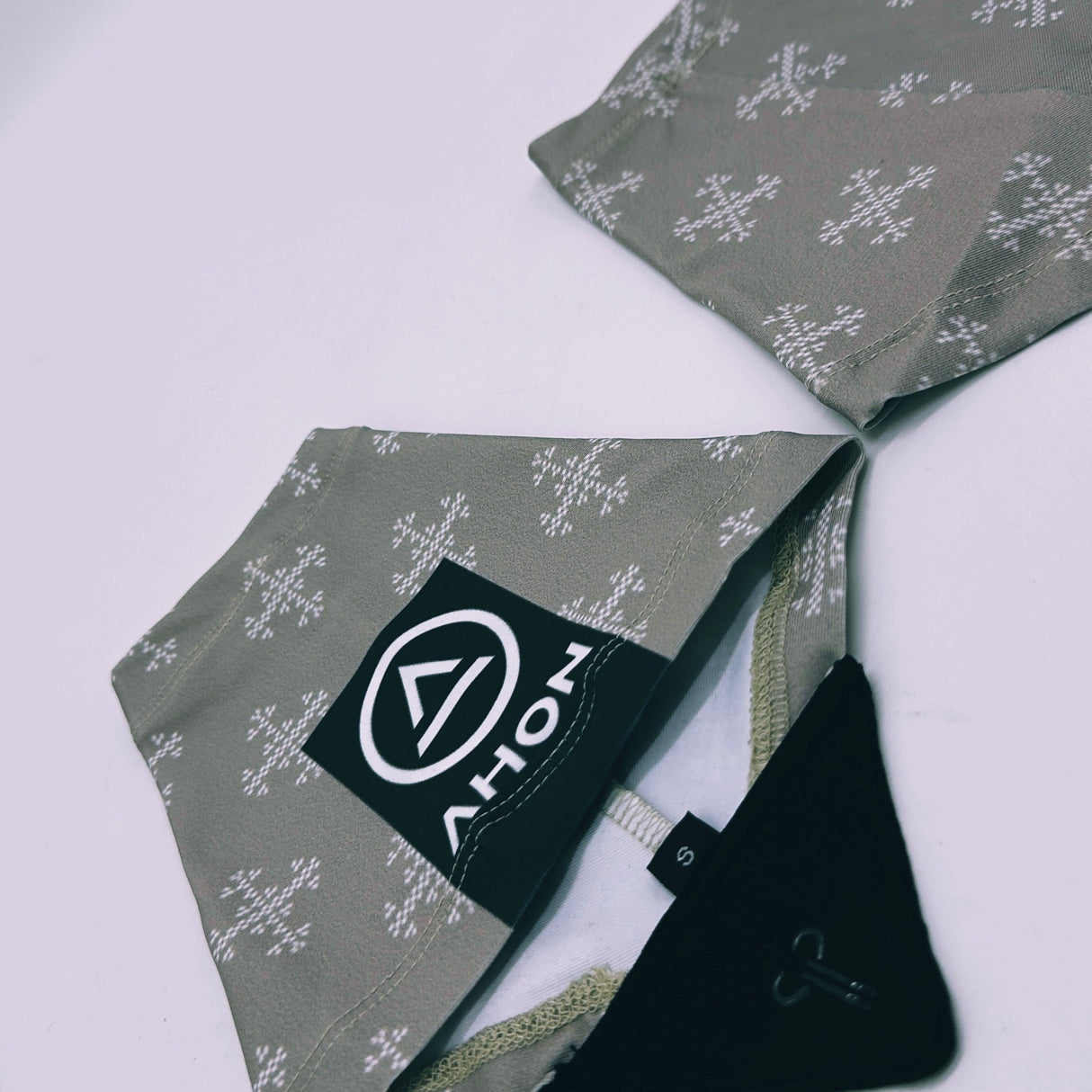 Pair of Apo 2 trail running gaiters by Ahon with logo visible