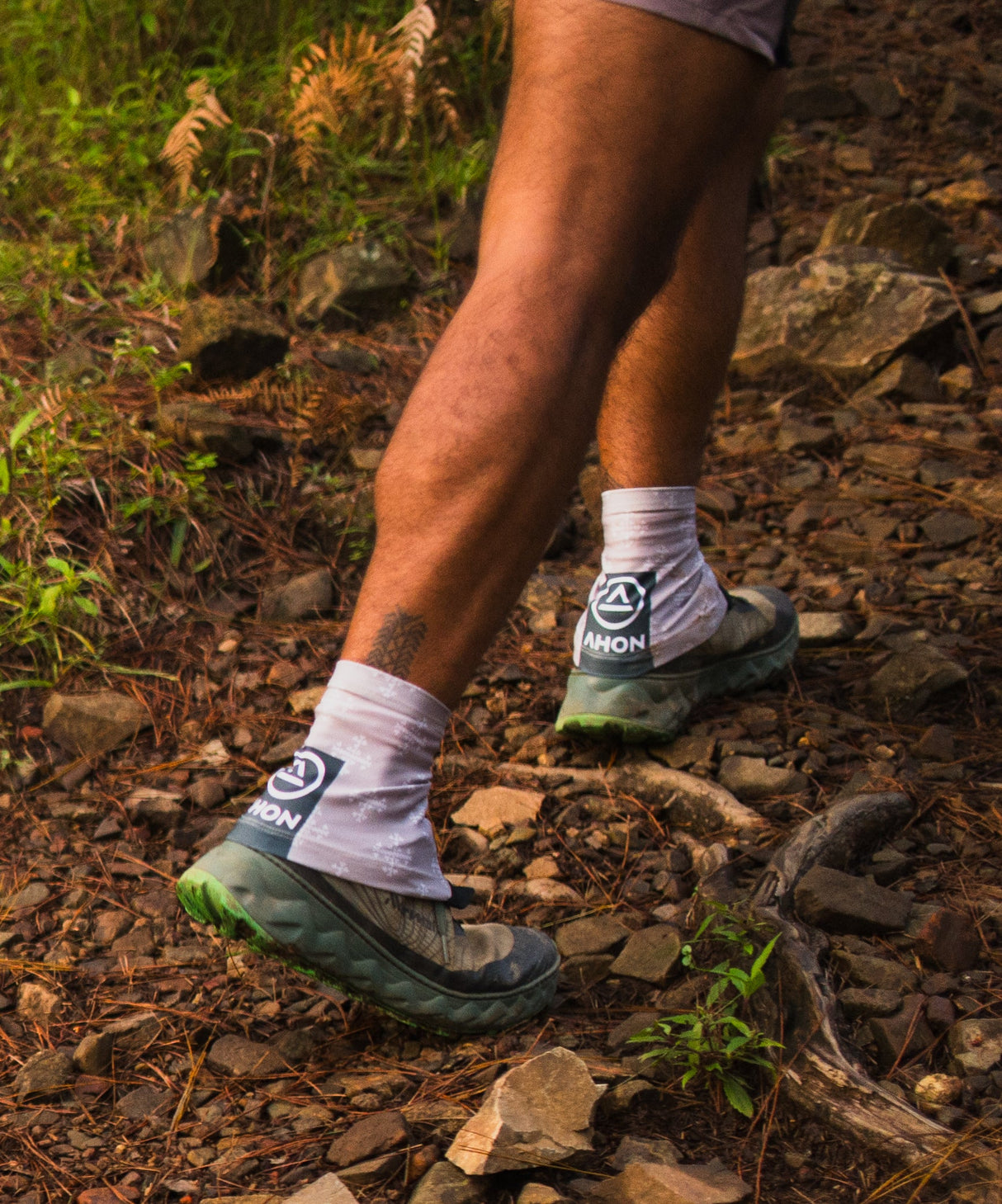 Back view of Ahon gaiters during uphill trail movement