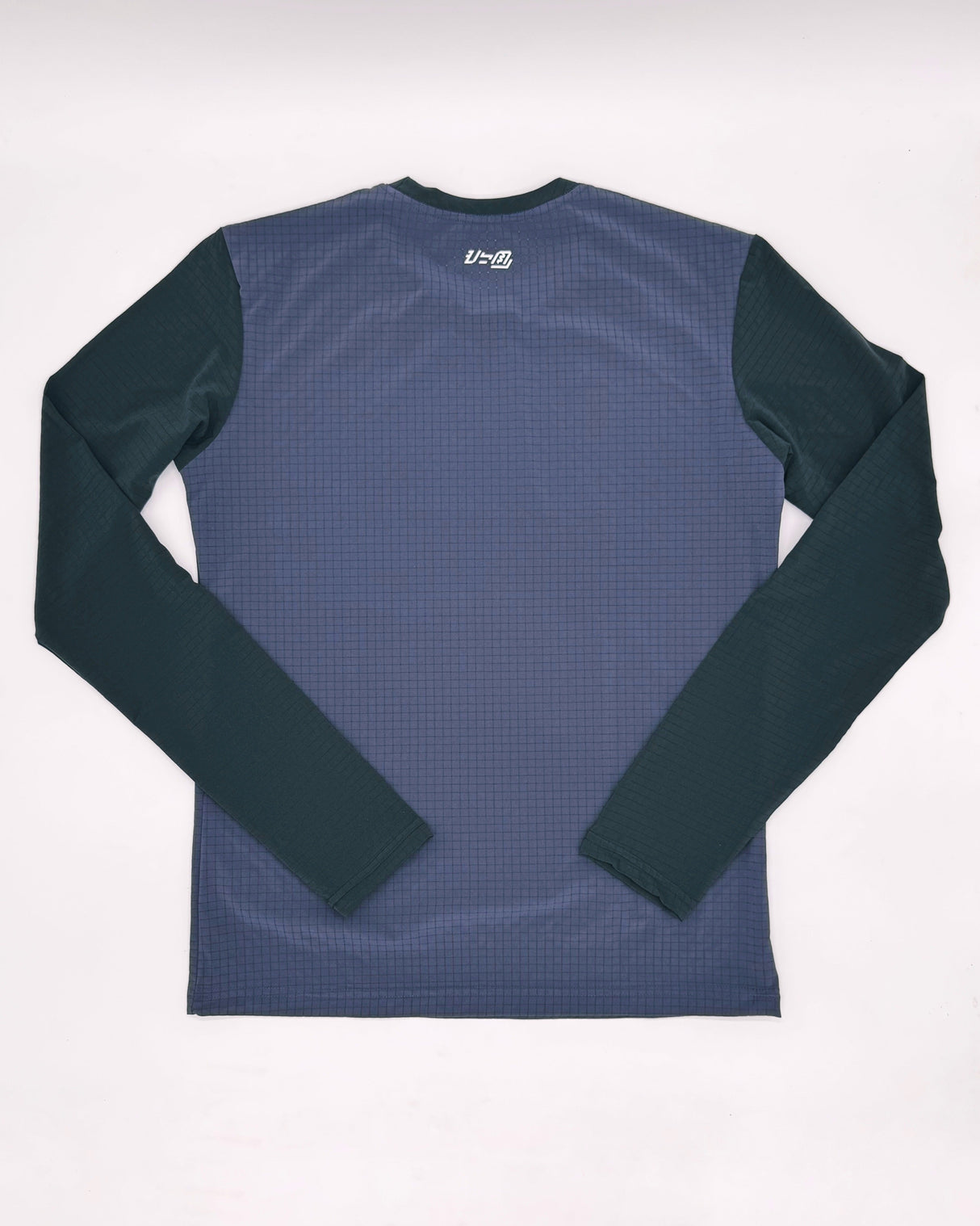 Flatlay of Apo Super Light LS Shirt in Dark Purple back design