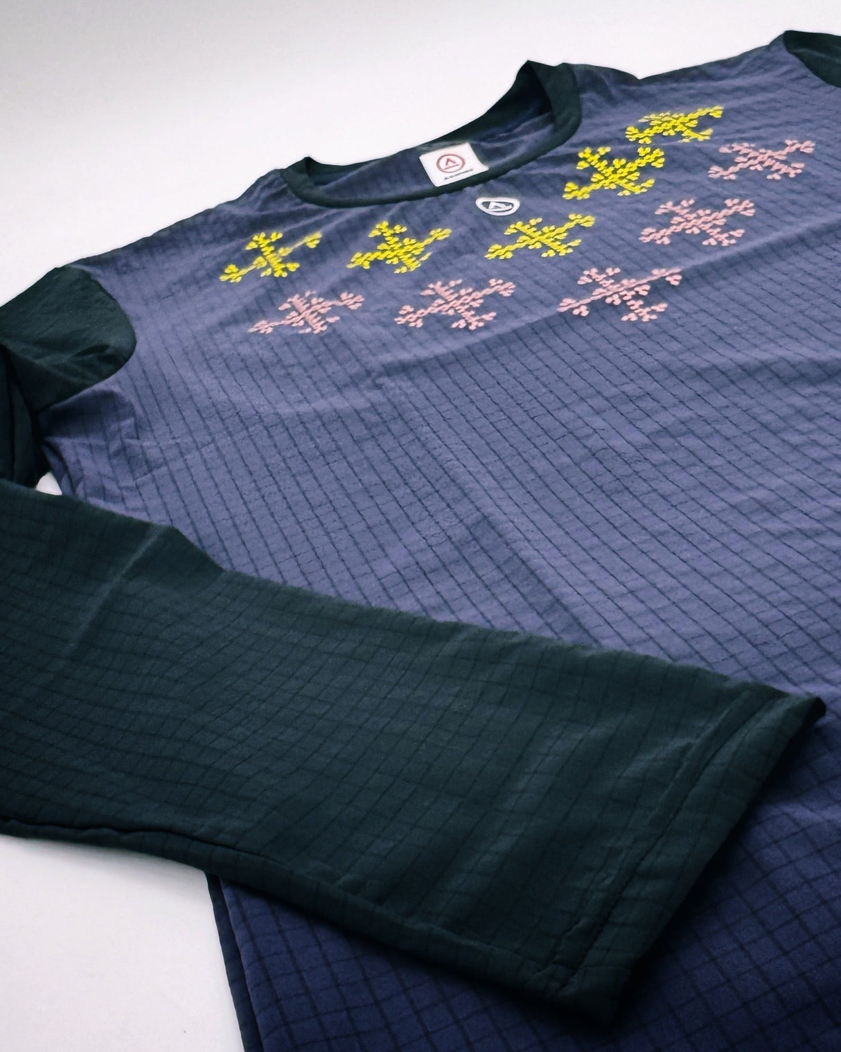 Flatlay of Apo Super Light LS Shirt in Dark Purple with Filipino-inspired print front design