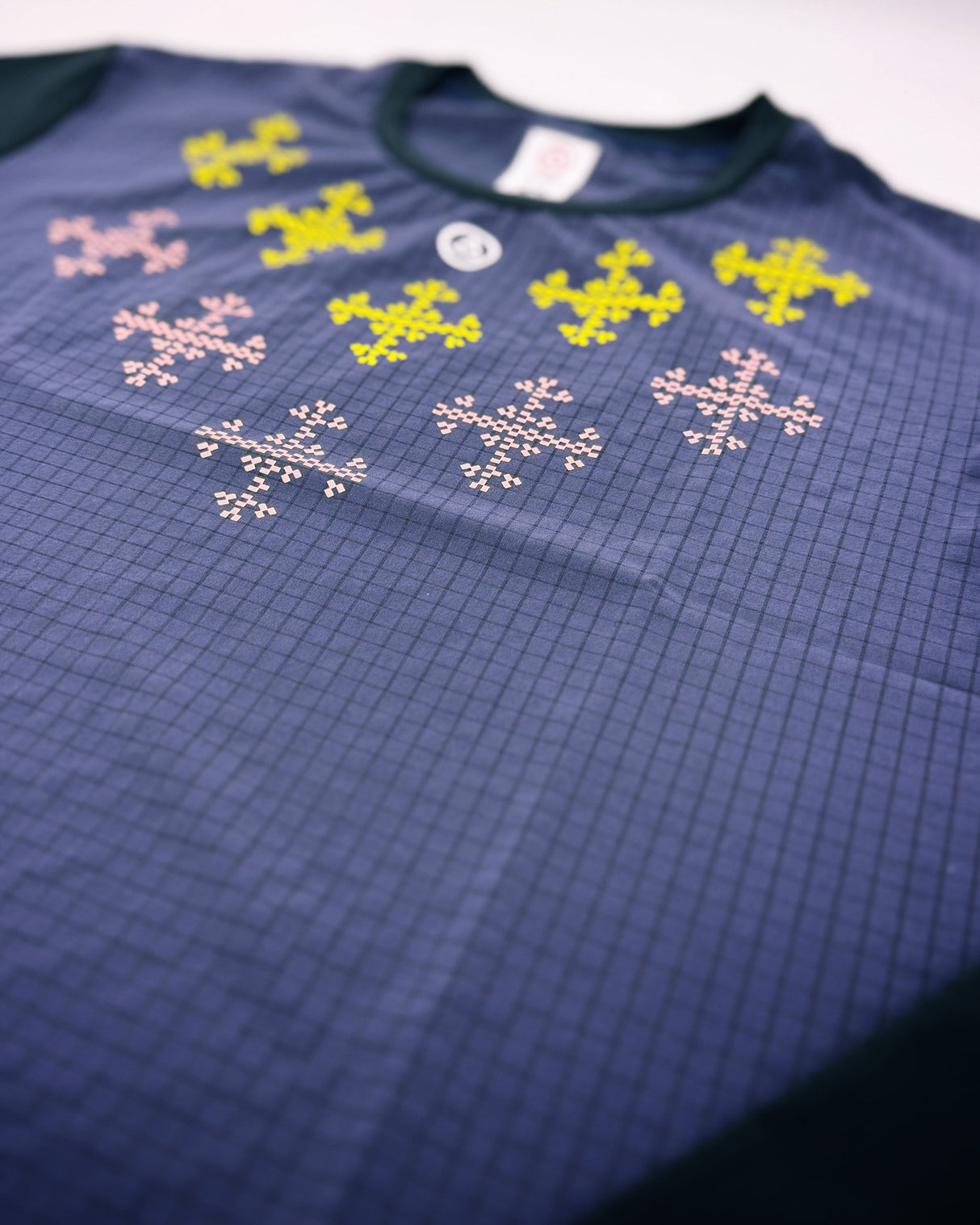 Flatlay of Apo Super Light LS Shirt in Dark Purple with Filipino-inspired print front design