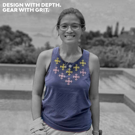 Trail runner smiling in Ahon Apo Super Light Singlet (Dark Purple) with printed mountain-inspired accents.