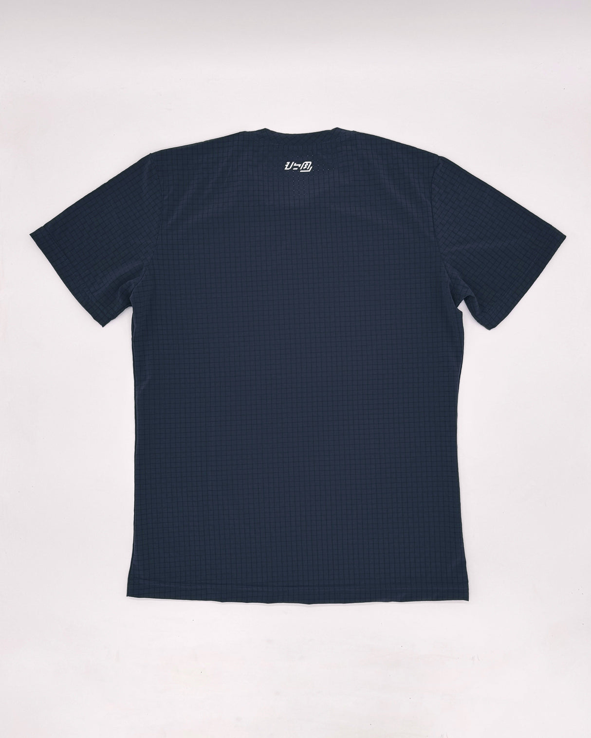 Flat lay of the Apo Super Light Shirt showing the back