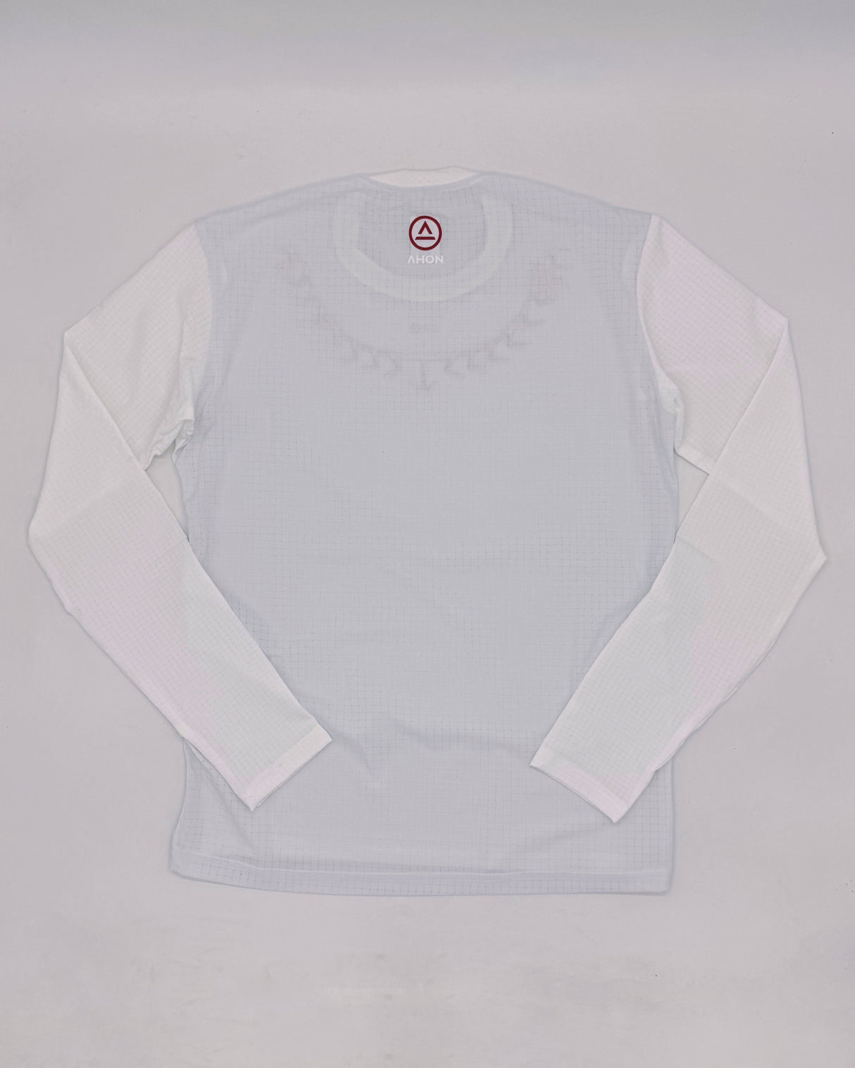 flat lay shot of Ahon Koling White long sleeve trail shirt