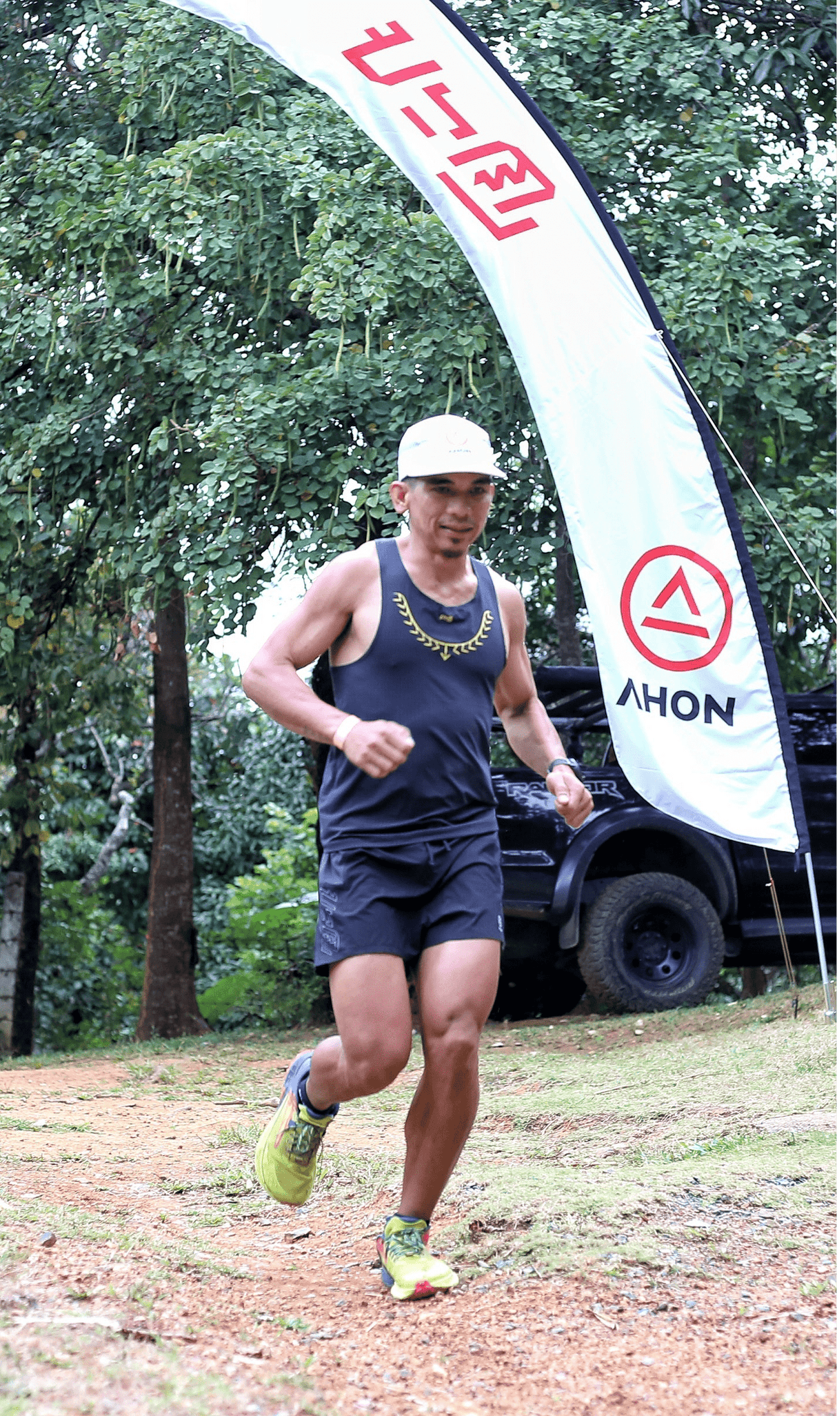 Ahon trail runner running in Ahon Koling Super Light Singlet black