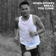 Trail runner wearing Koling Super Light Singlet white front with red detail, navy back