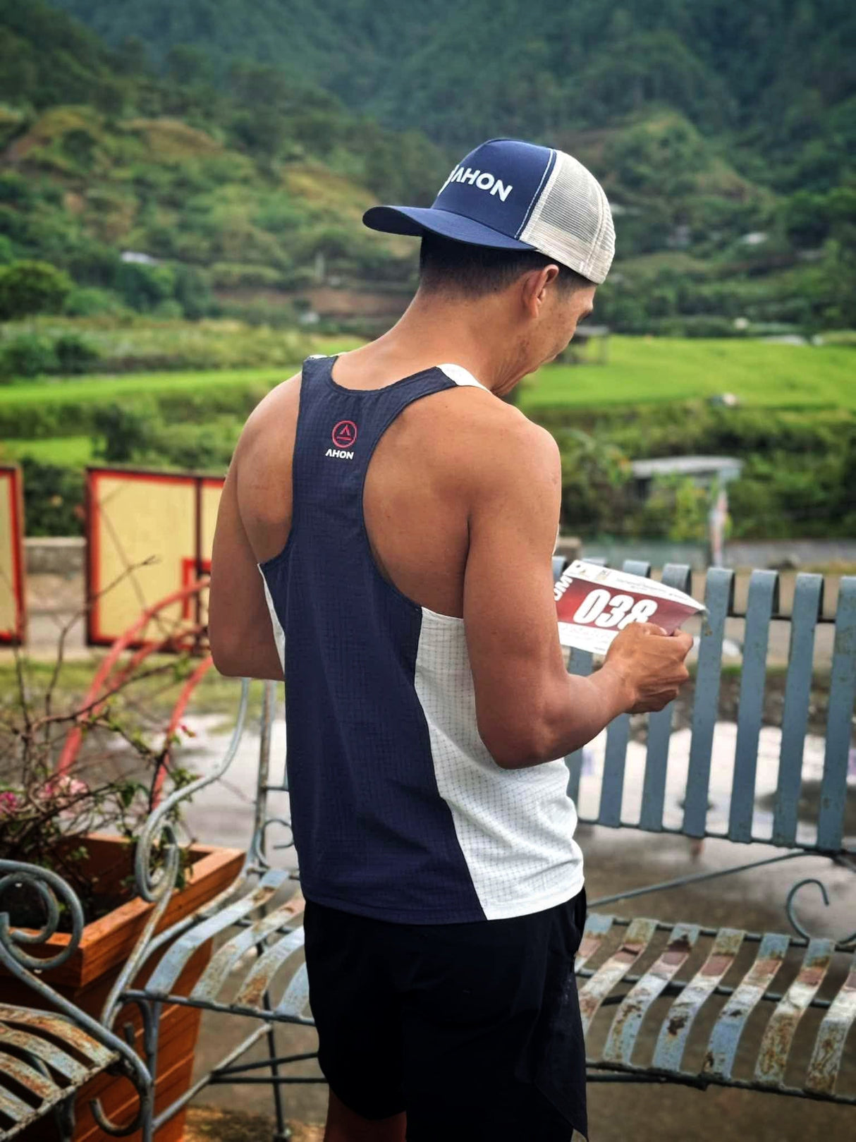 Rear panel of Koling White/Navy Singlet in dark navy tone, open-arm cut