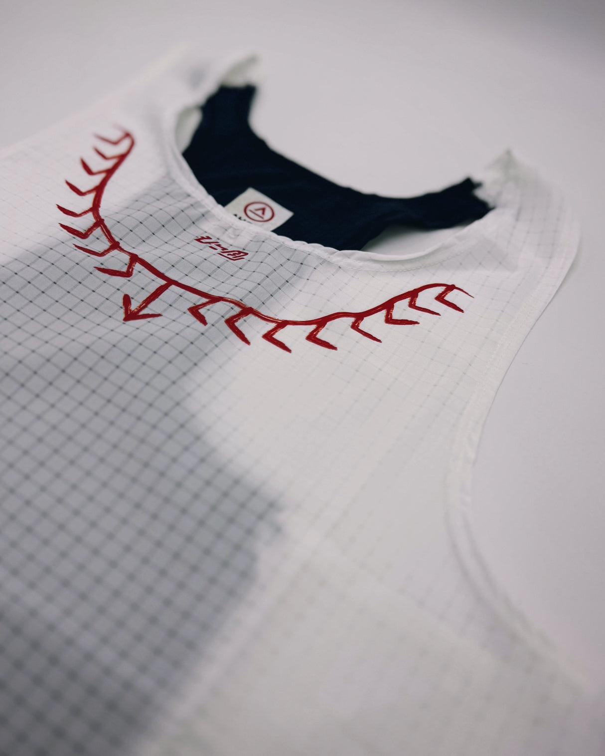 Koling Super Light Singlet white and navy laid flat to show full design