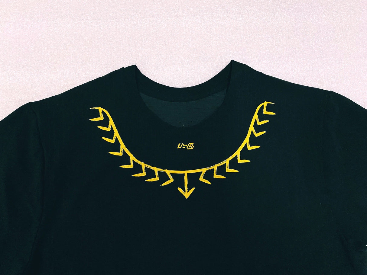 Detailed shot of tattoo-inspired yellow neck graphic on the Koling Super Light SS Shirt by Ahon