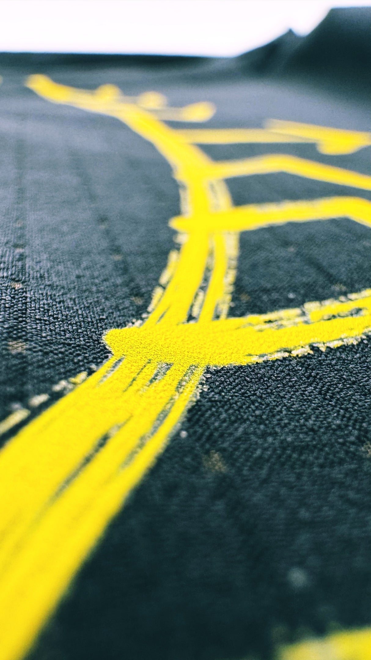 Ahon shirt showcasing yellow graphic design inspired by traditional Filipino tattoo patterns for trail movement.