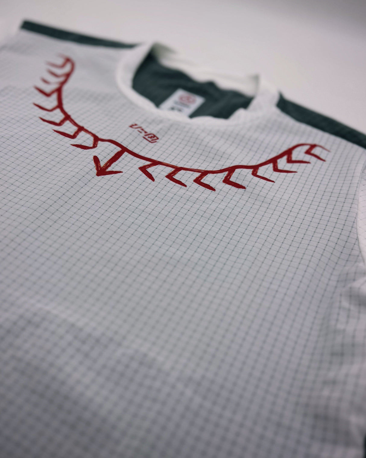 Close-up of Super Light polyester fabric on Koling Shirt showing texture and seams