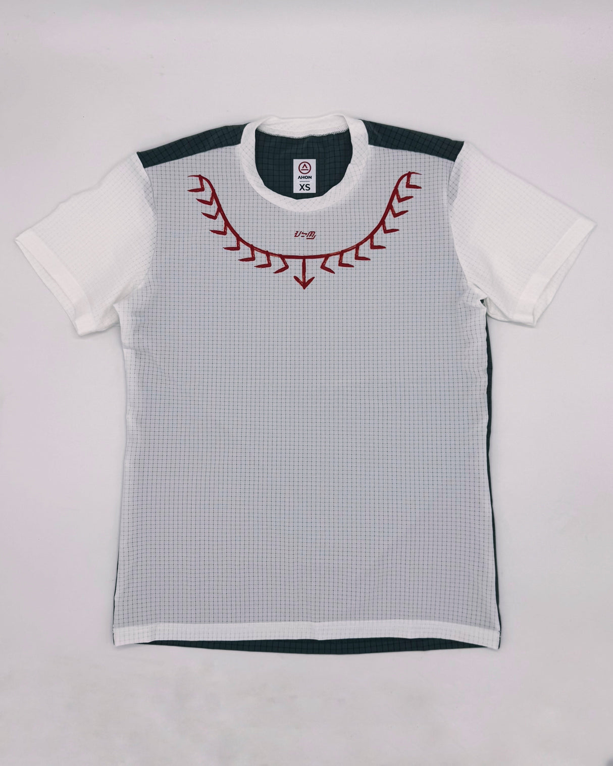 Flat lay of Koling Super Light Shirt showing front red detail and gray panel back design
