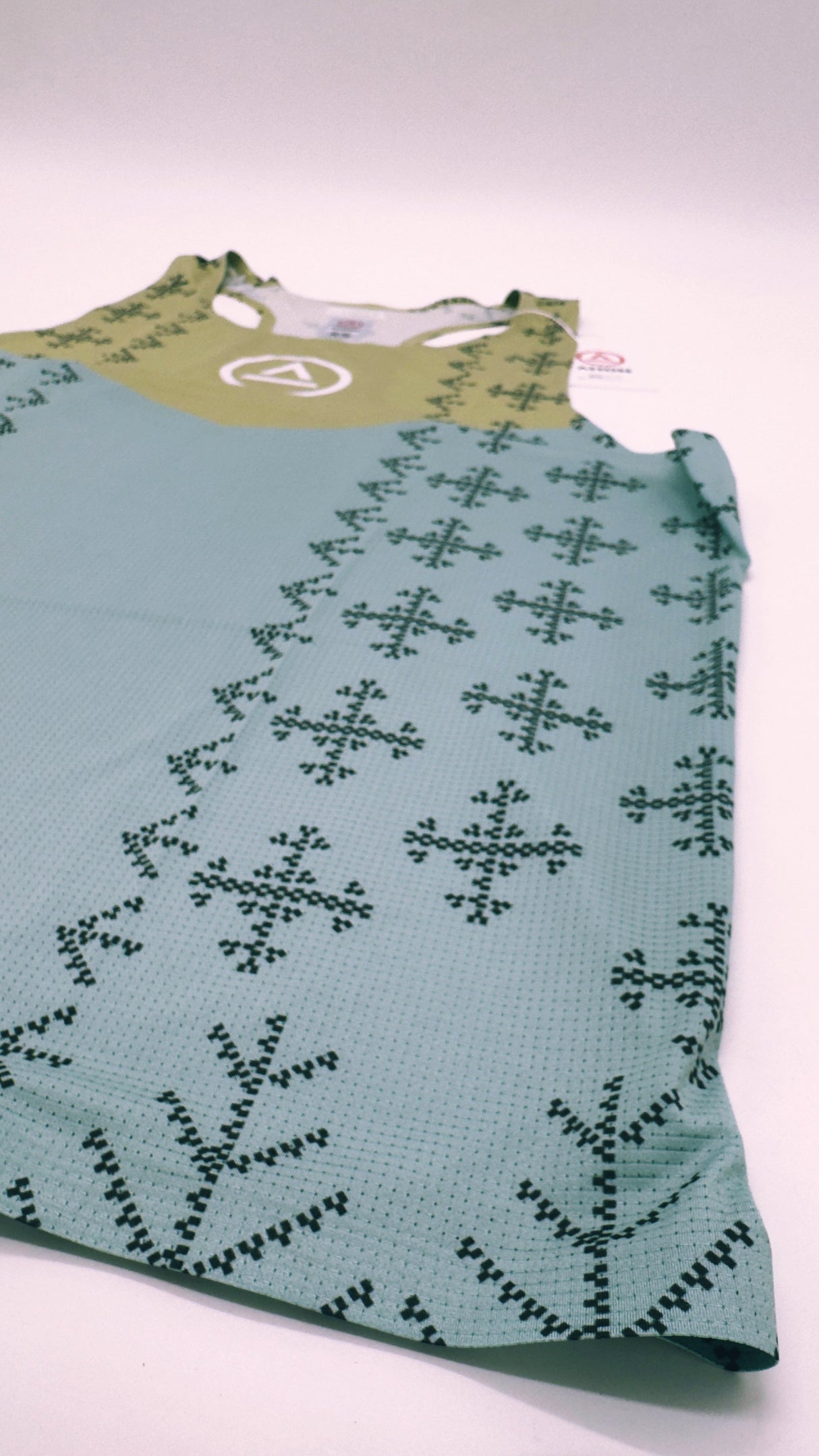 Zoomed detail of Singlet Pro Colorway 2 fabric showing trail-ready texture and indigenous-inspired print