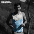Male trail runner wearing Ahon Singlet Pro Colorway 2, with bold pattern inspired by Bagobo weaving, captured mid-run with the text ‘Stop staring. Start running.’