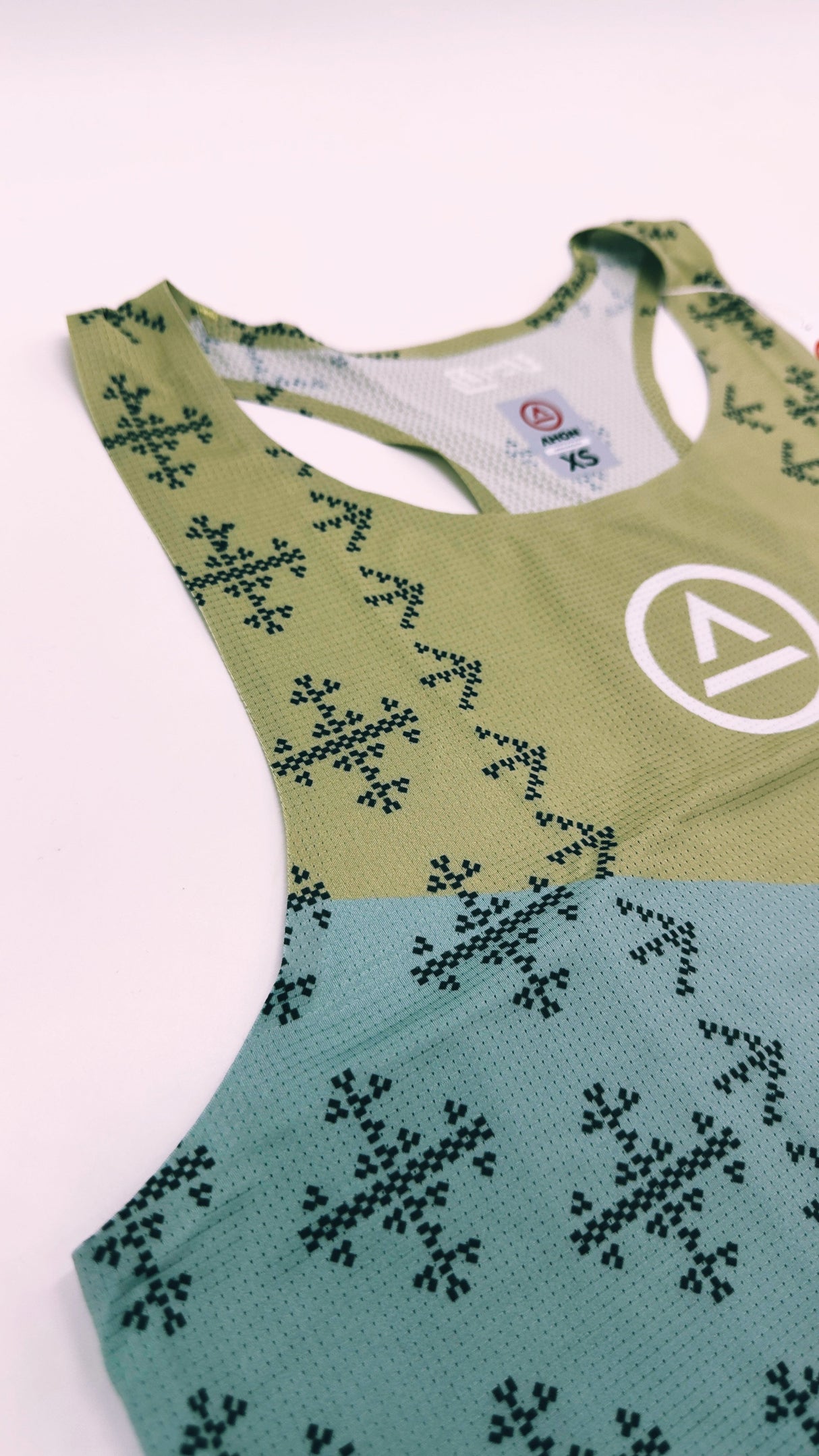 Zoomed detail of Singlet Pro Colorway 2 fabric showing trail-ready texture and indigenous-inspired print