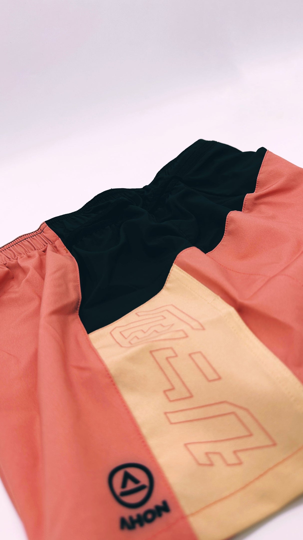 Side view of Ahon Trail Shorts Pro with bold seams and tonal pattern details