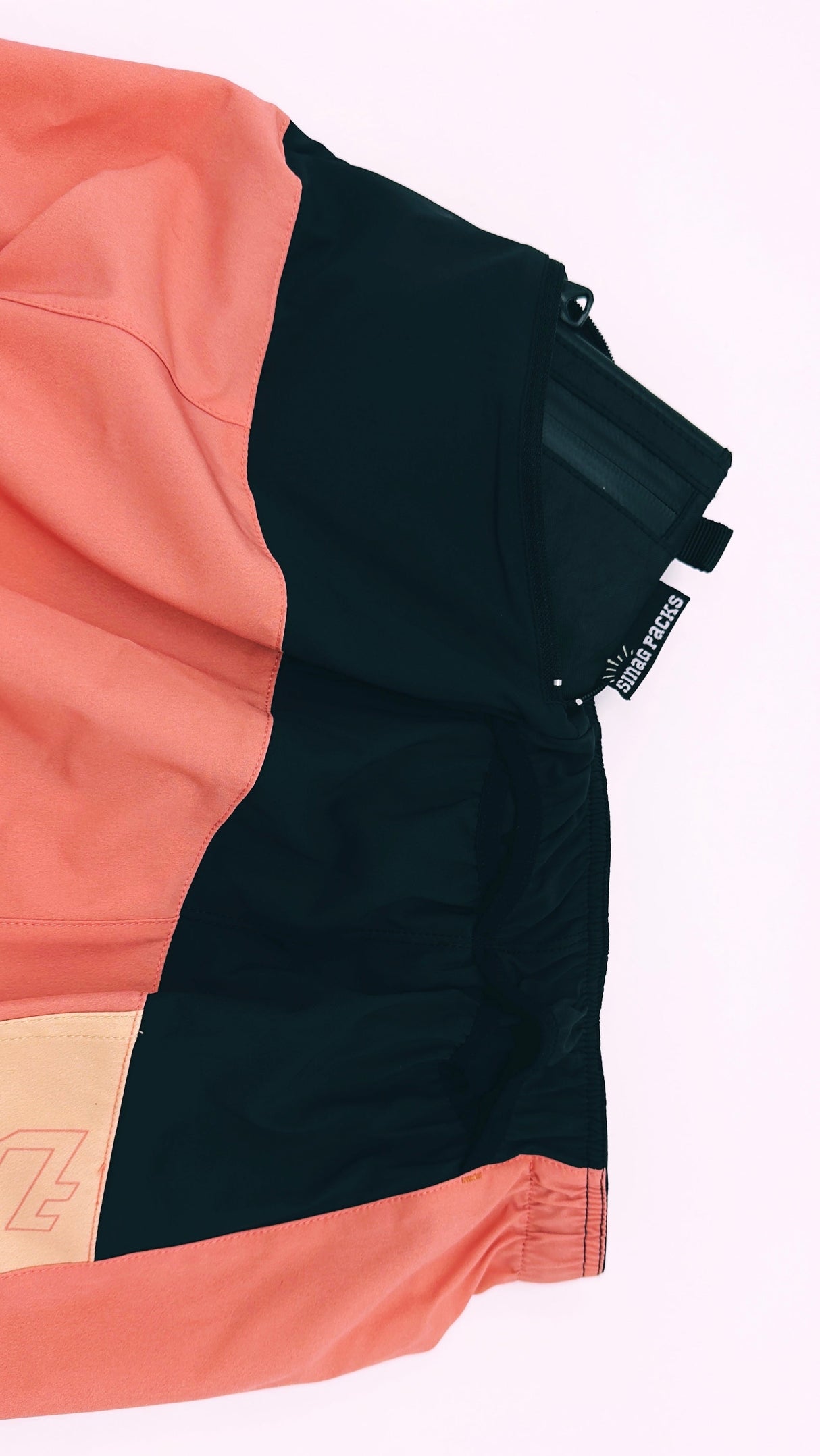 Side view of Ahon Trail Shorts Pro with bold seams and tonal pattern details