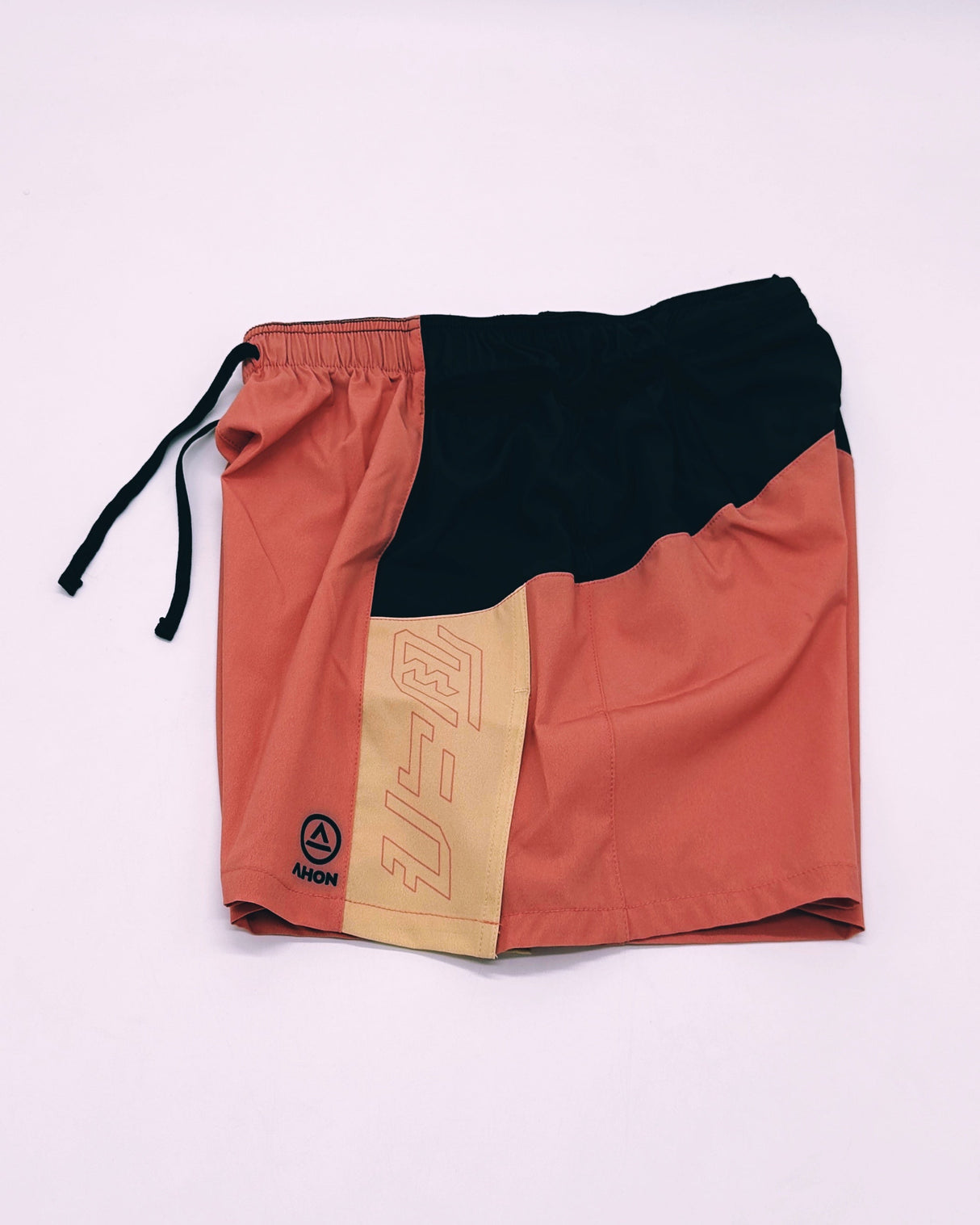 Side view of Ahon Trail Shorts Pro with bold seams and tonal pattern details