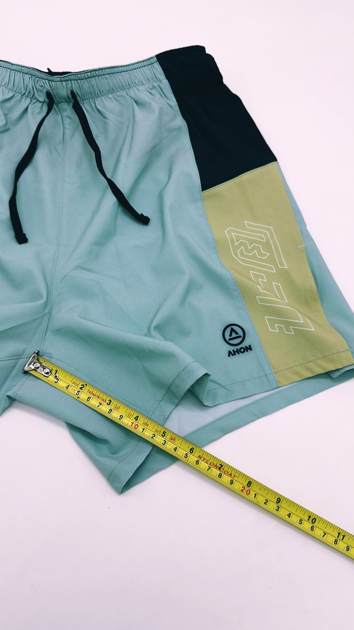 Flatlay of Ahon Trail Shorts Pro showing 5-inch inseam
