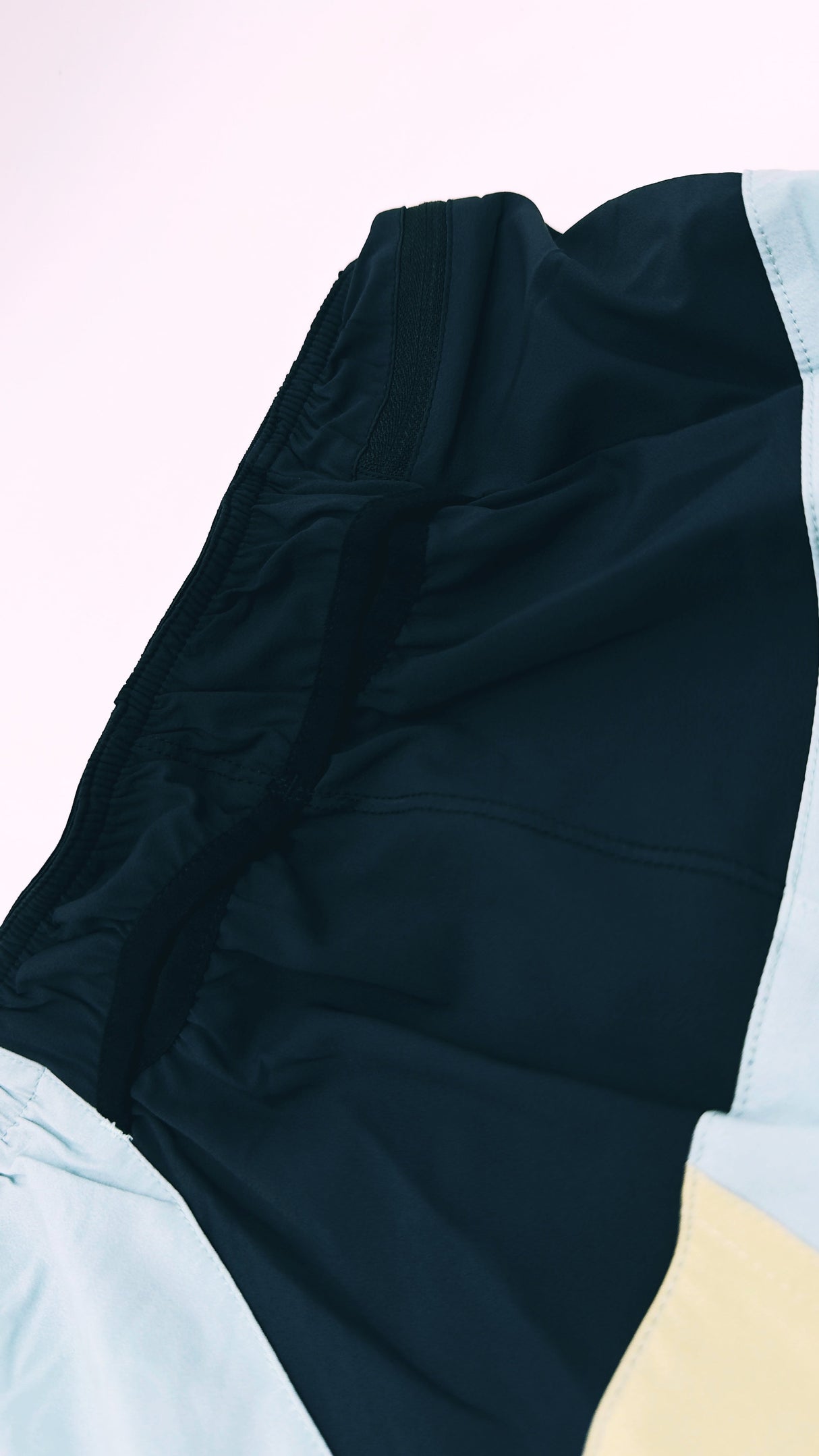 back view of Trail Shorts Pro showing stretch pockets and race-fit design