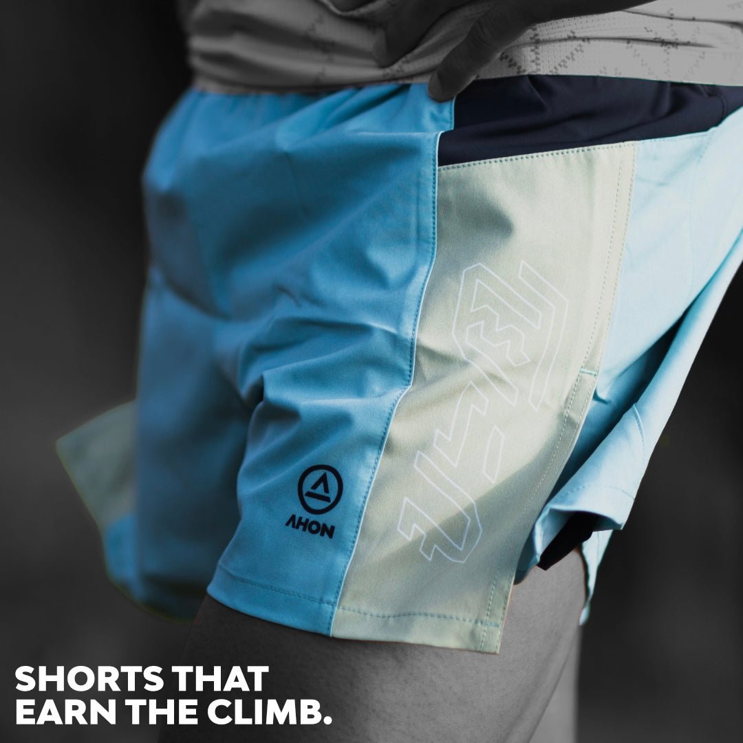 Ahon Trail Shorts Pro Colorway 2 – 5-inch split shorts in light blue and mint, shown on runner