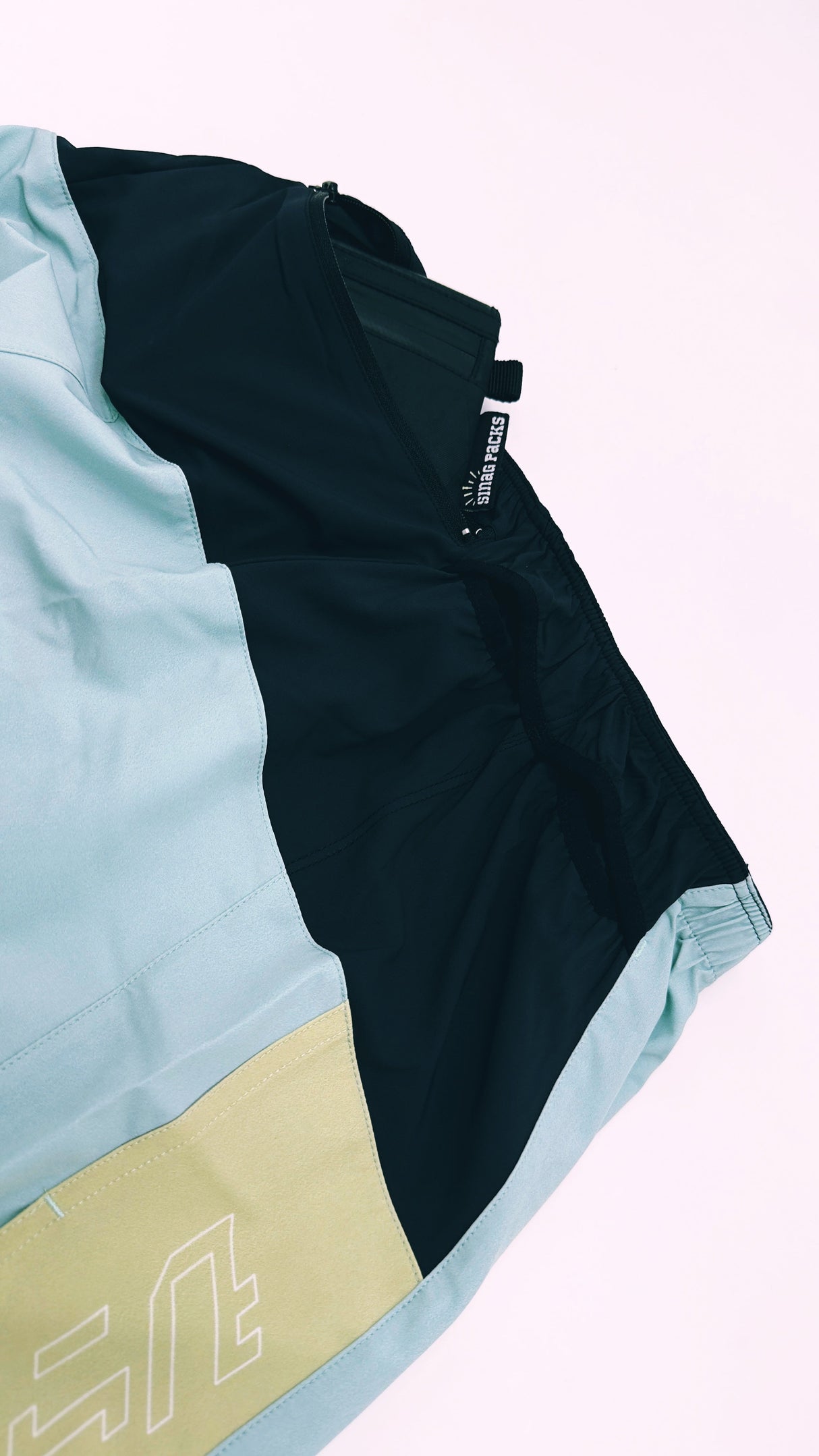 back view of Trail Shorts Pro showing stretch pockets and race-fit design