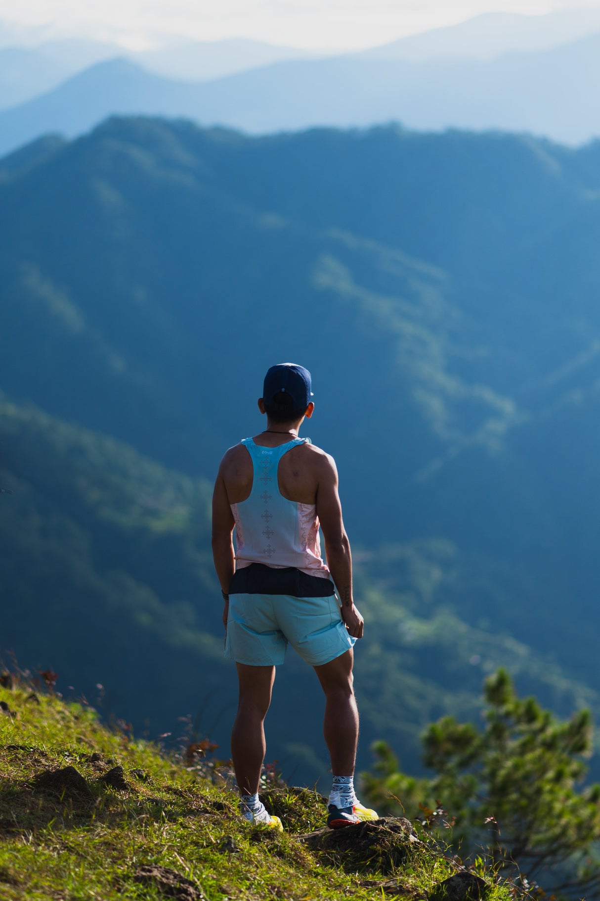 male trail runner wearing Ahon Trail Shorts Pro Colorway 2 – 5-inch split shorts