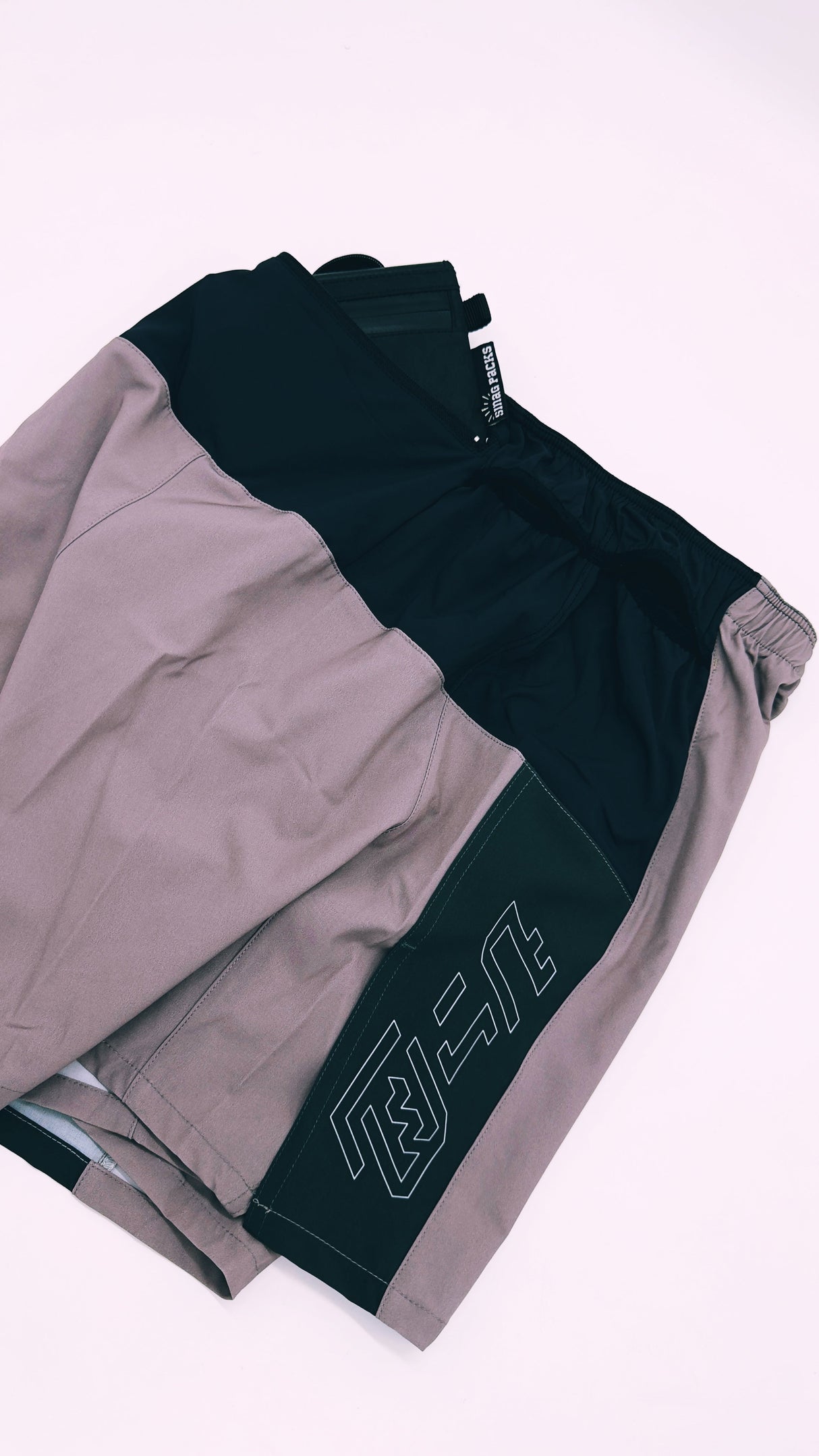 Trail Shorts Pro (colorway 3) 5 - inch inseam, showing what can fit in the back pocket