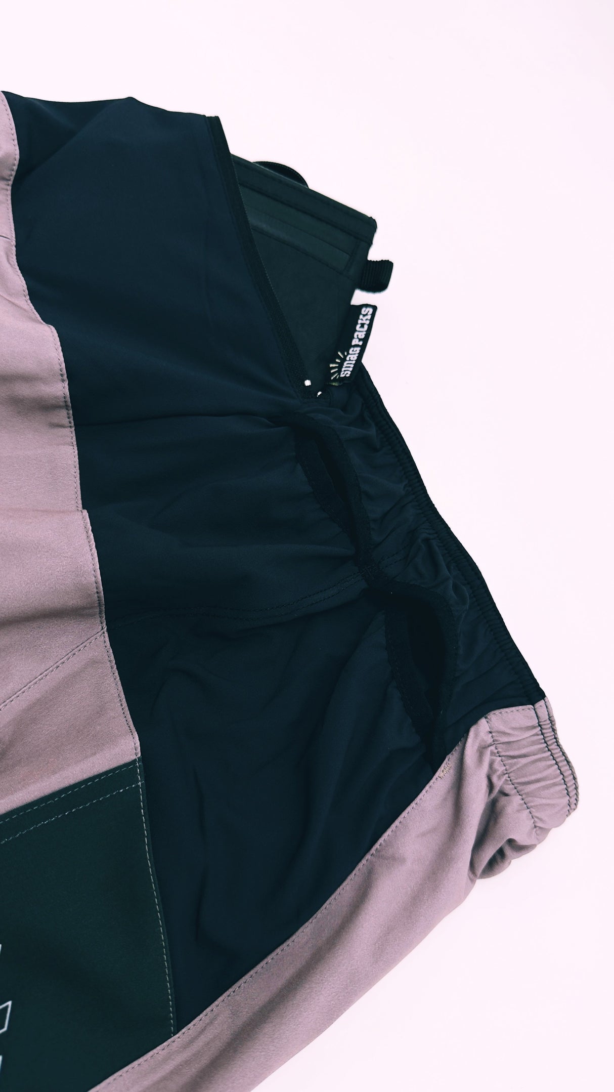 Trail Shorts Pro (colorway 3) 5 - inch inseam, showing what can fit in the back pocket - closer view