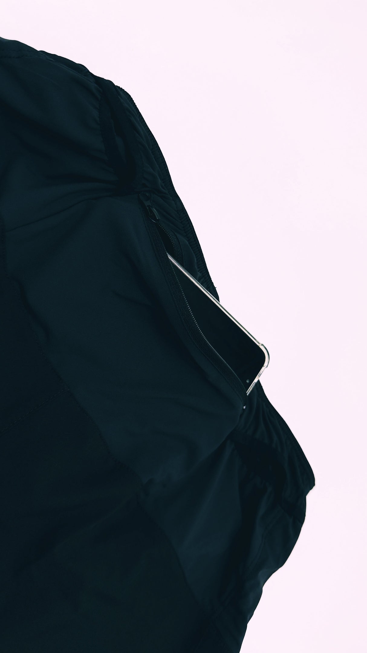 close-up of Ahon Trail Shorts Pro (Colorway 4), showing phone in back pocket