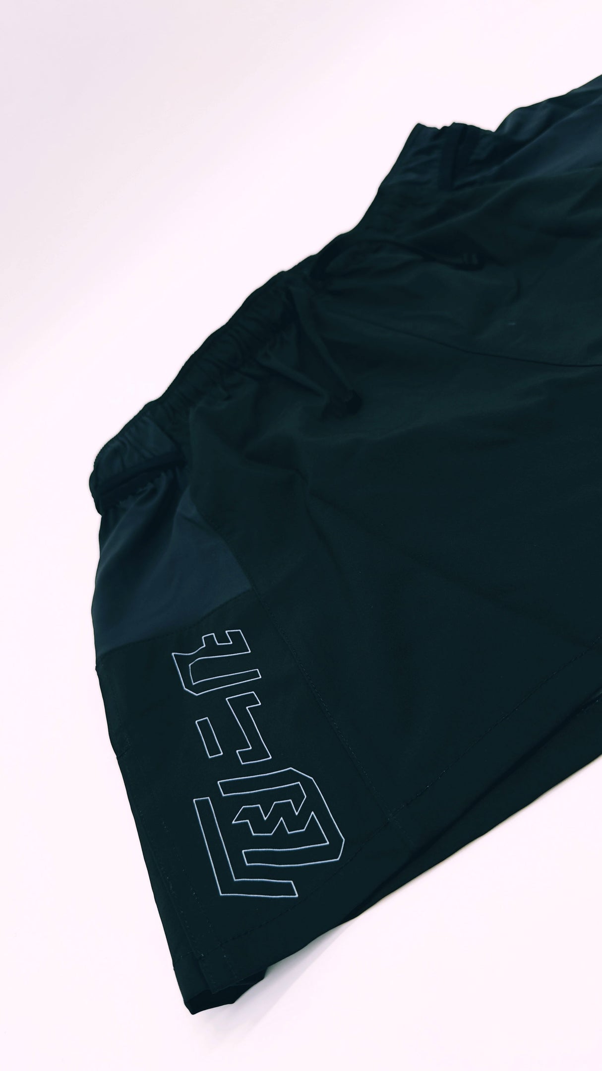 flatlay of Ahon Trail Shorts Pro (Colorway 4) showing split side design and side pockets