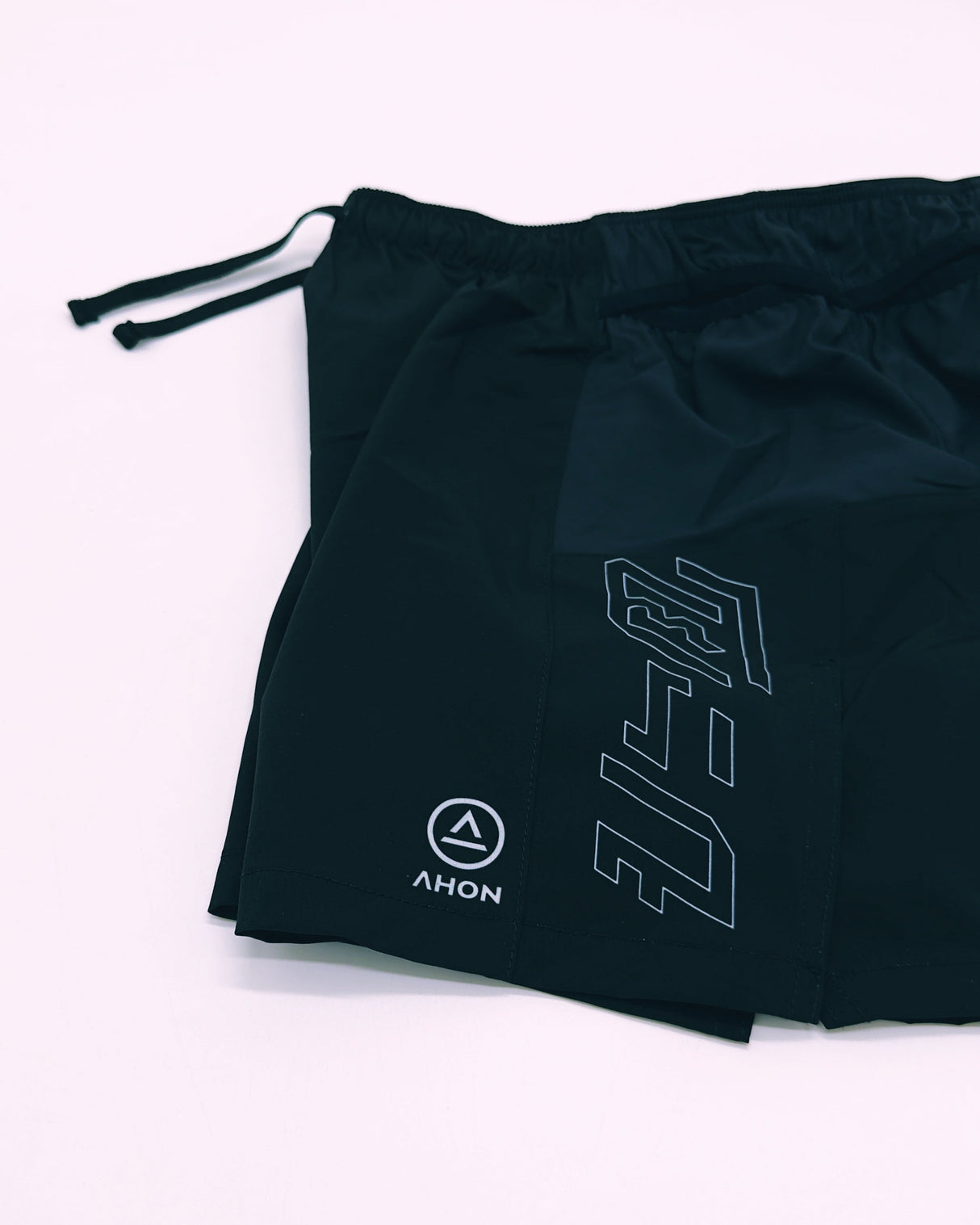 Close-up of Ahon Trail Shorts Pro (Colorway 4) showing split side design and side pockets, side view