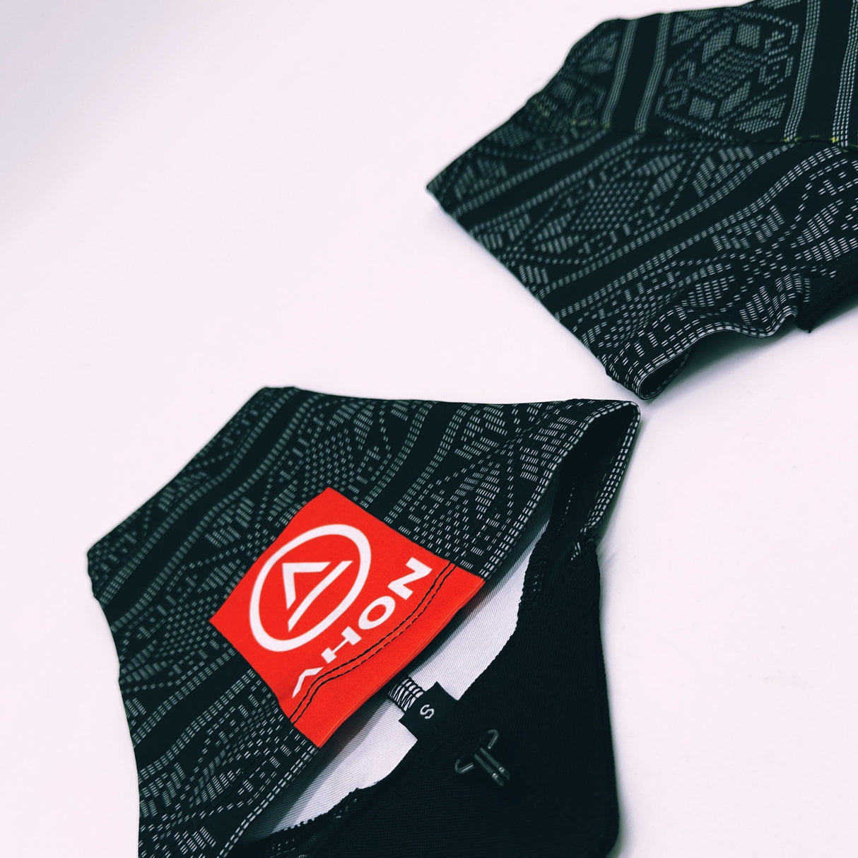 Flatlay of Ahon Uleyan 1 Trail Gaiters showing traditional filipino weaving-inspired design and red Ahon logo patch