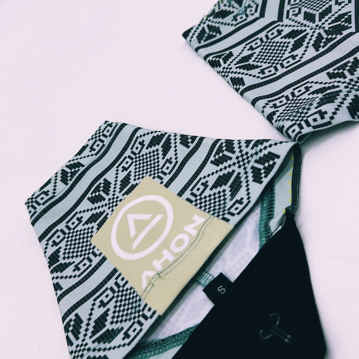 Flatlay of Ahon Uleyan 2 Trail Gaiters showing woven-inspired design and hook-tab system