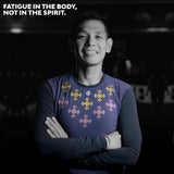 Male trail runner smiling while wearing the Apo Super Light LS Shirt in Dark Purple with woven-inspired design, text overlay reads 'Fatigue in the body, not in the spirit'