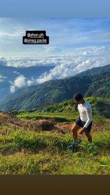 Trail runner wearing Koling Super Light LS Shirt in white, mid-stride during race
