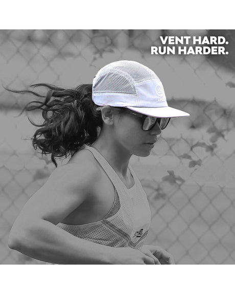 female runner in Ahon gray mesh running cap on trail