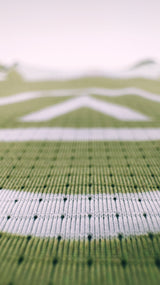 Zoomed detail of Singlet Pro Colorway 2 fabric showing trail-ready texture and indigenous-inspired print