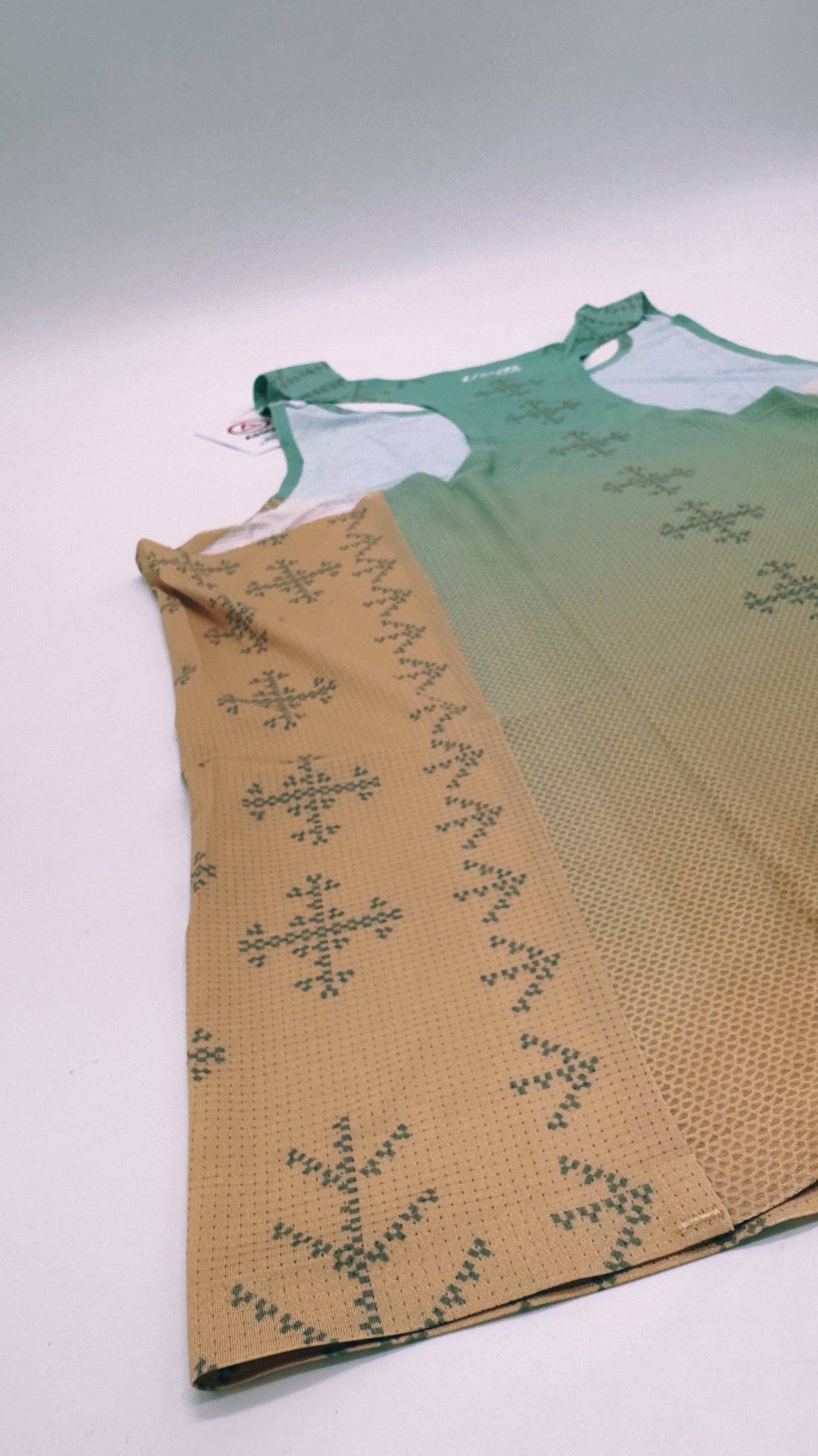 Singlet Pro flatlay – side profile showcasing armhole and fit