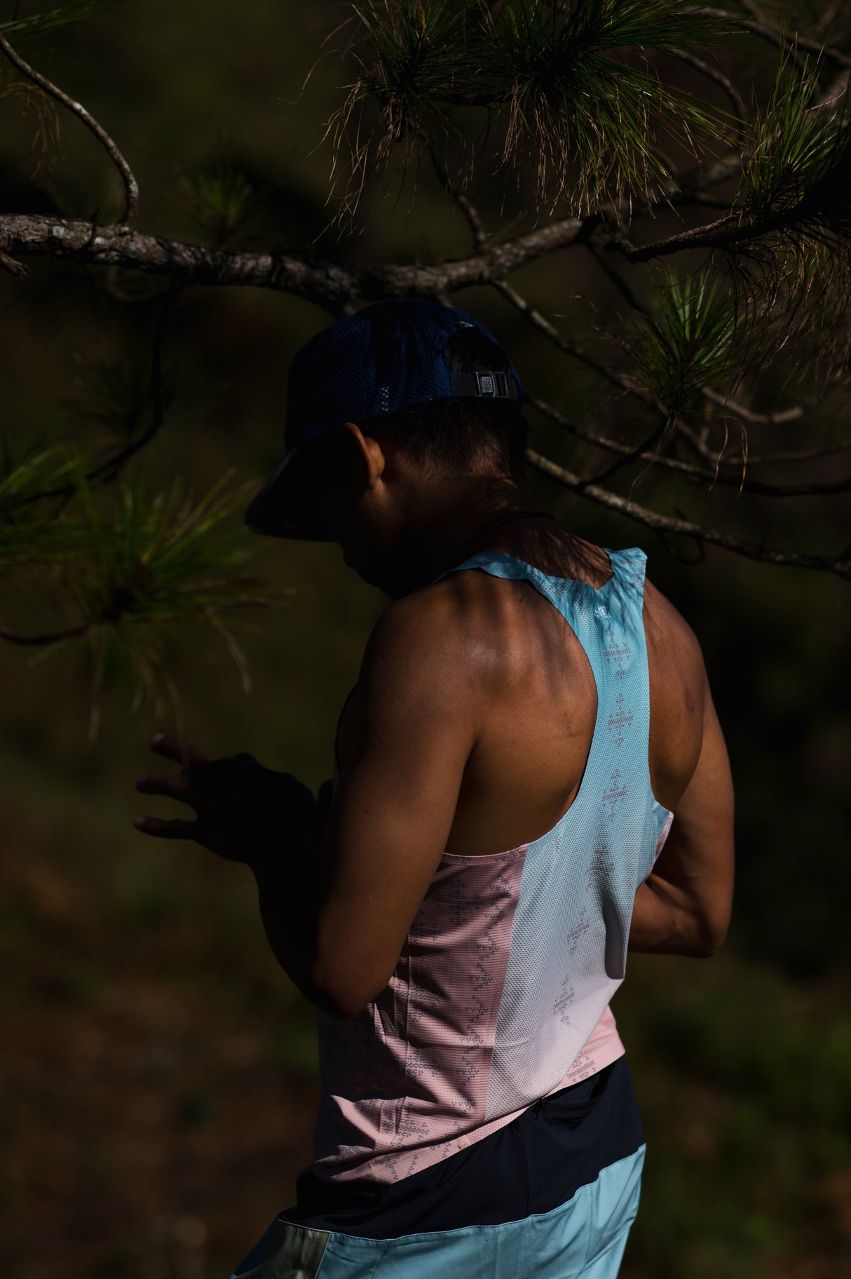 Singlet Pro on trail – side profile showcasing armhole and fit