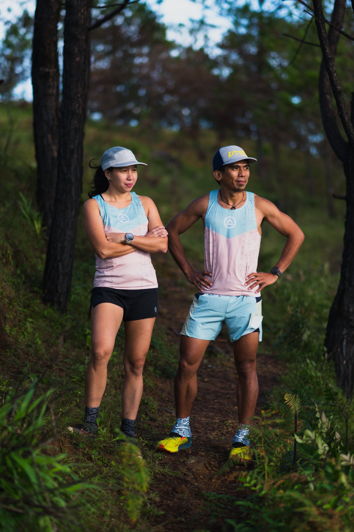 trail runners showing off fit and fabric texture of Ahon’s race singlet, with Ahon shorts, caps, gaiters, and socks