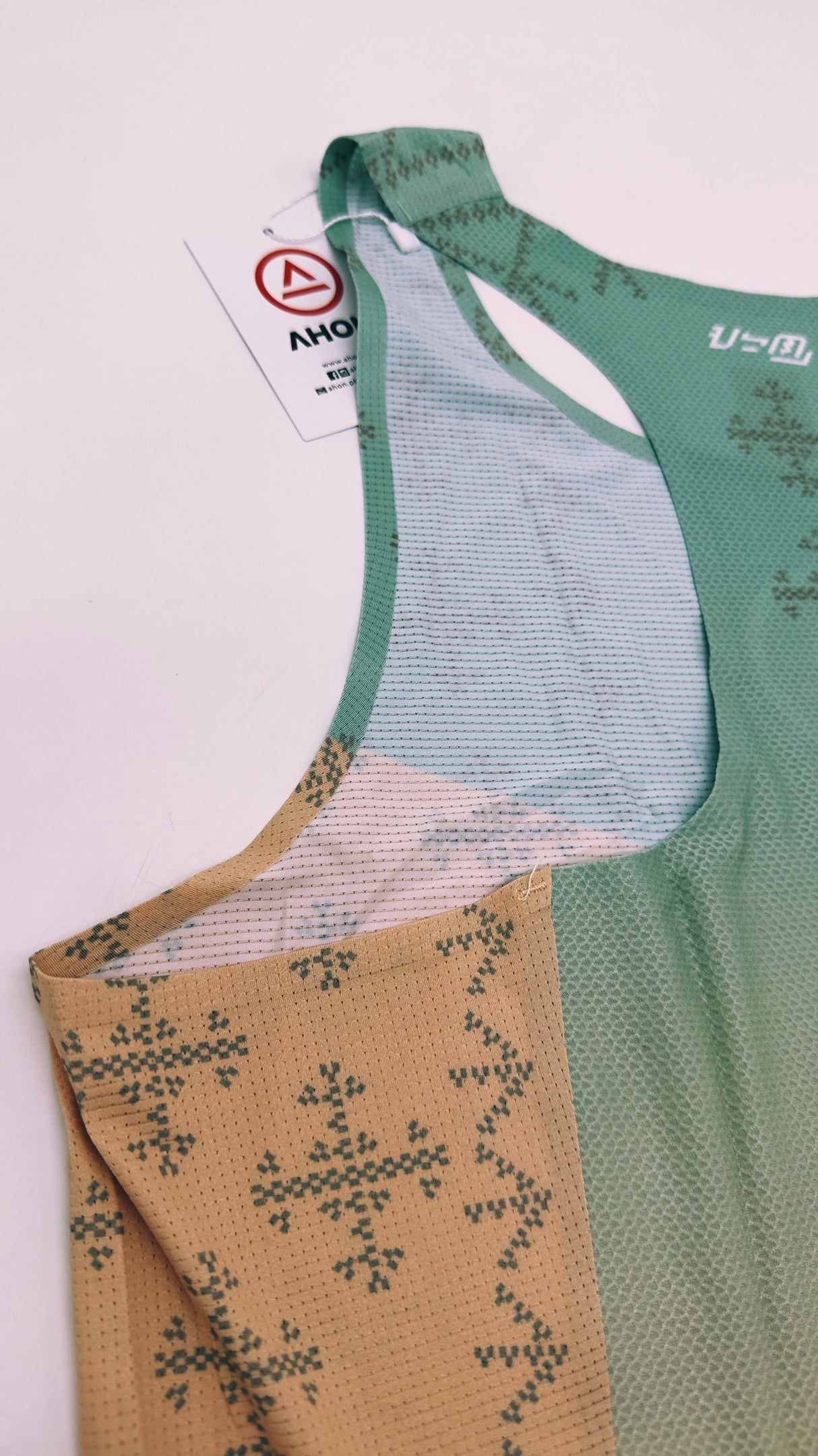 Singlet Pro flatlay – side profile showcasing armhole and fit