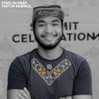 Male trail runner smiling while wearing the Uleyan Super Light SS Shirt in dark gray with colorful woven-inspired chest pattern