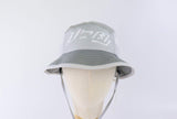 Close-up of the Baybayin script embroidery on the Ahon Bucket Hat in gray.